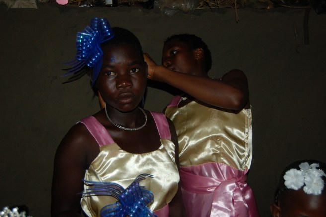 Sylvia helping Brenda with her headband in the otlum.