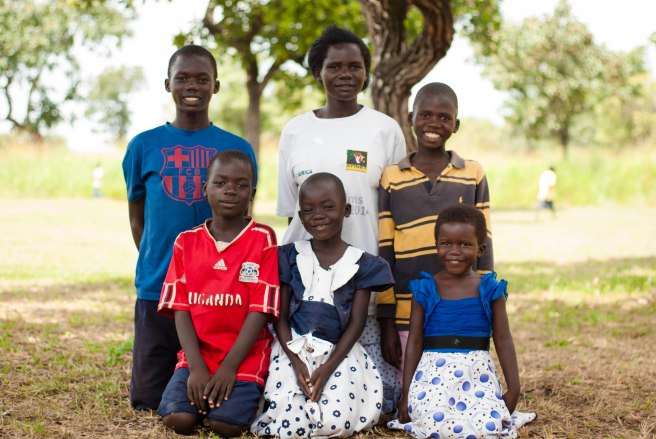 J (in the middle) with her family